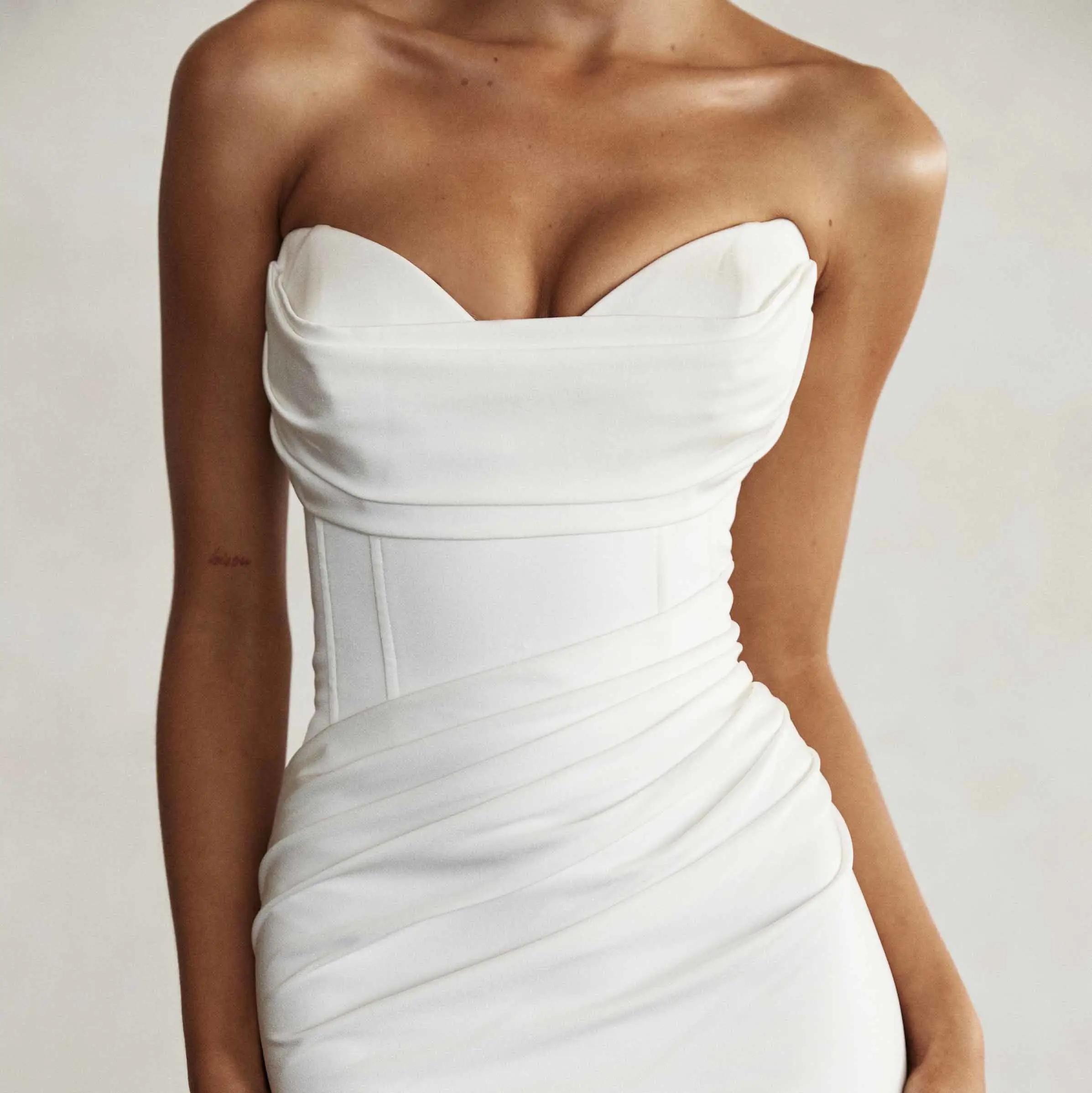Model wearing white Jane Hill dress
