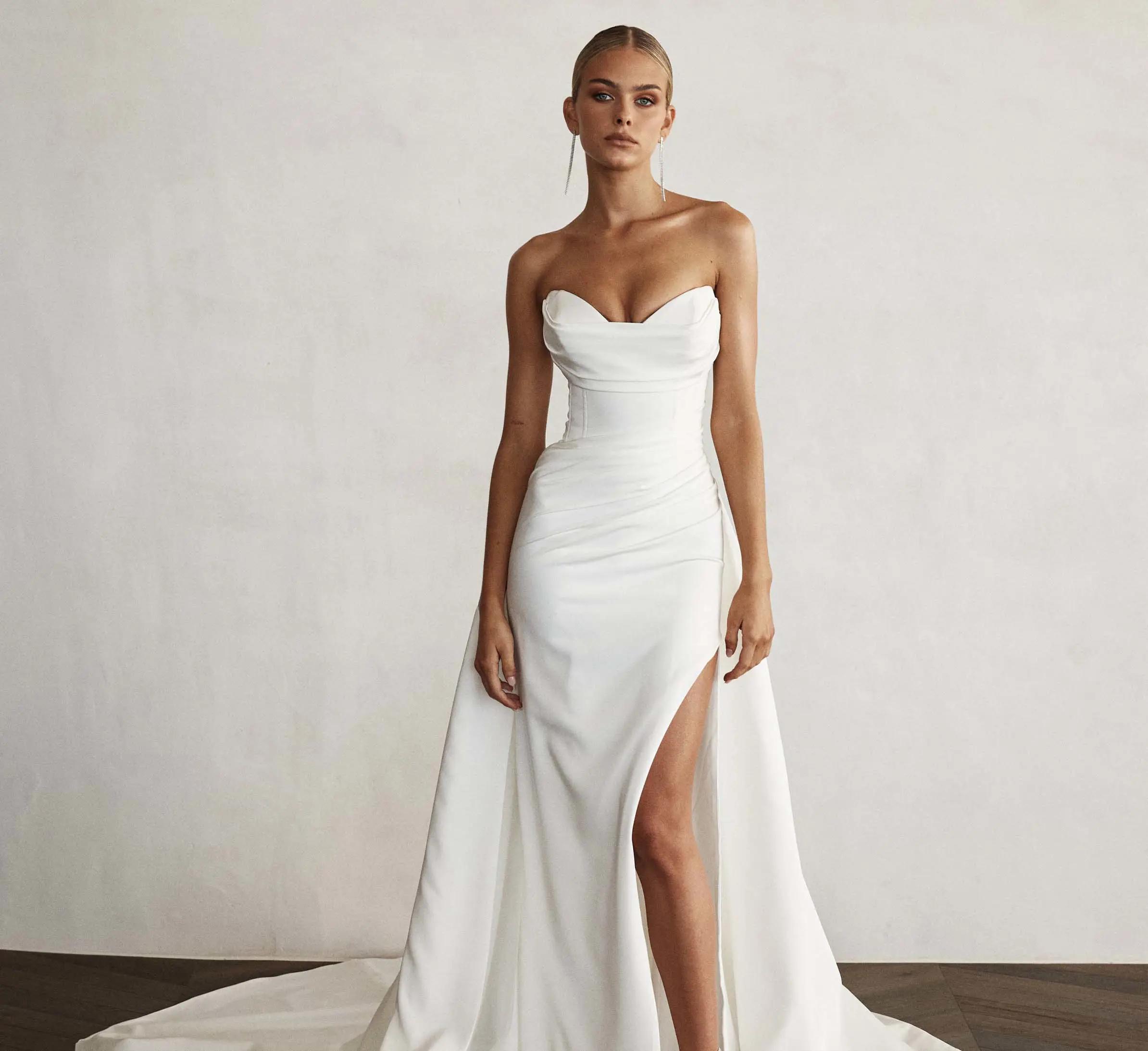 Model wearing white Jane Hill dress