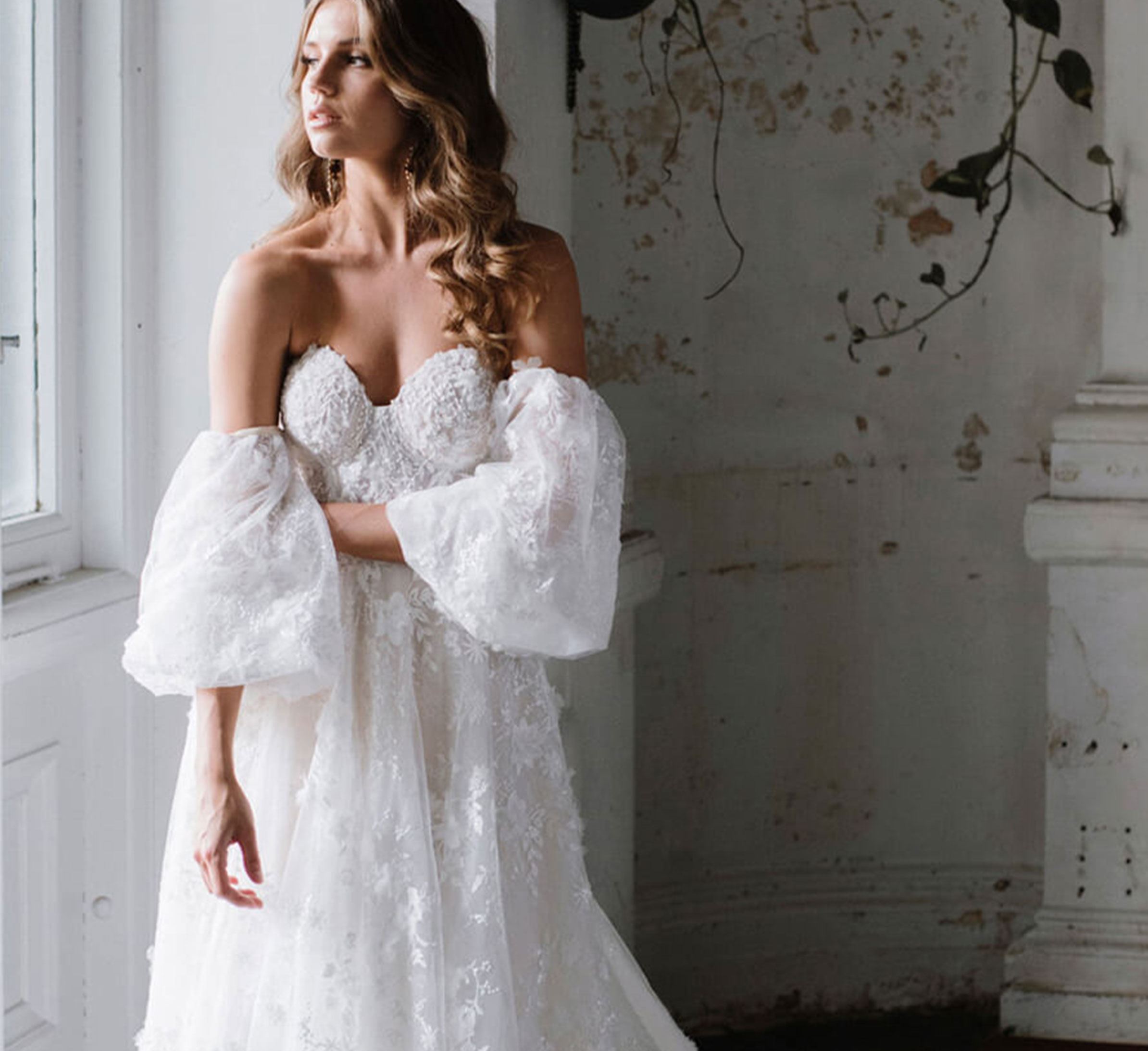 Model wearing white Hayley Paige dress