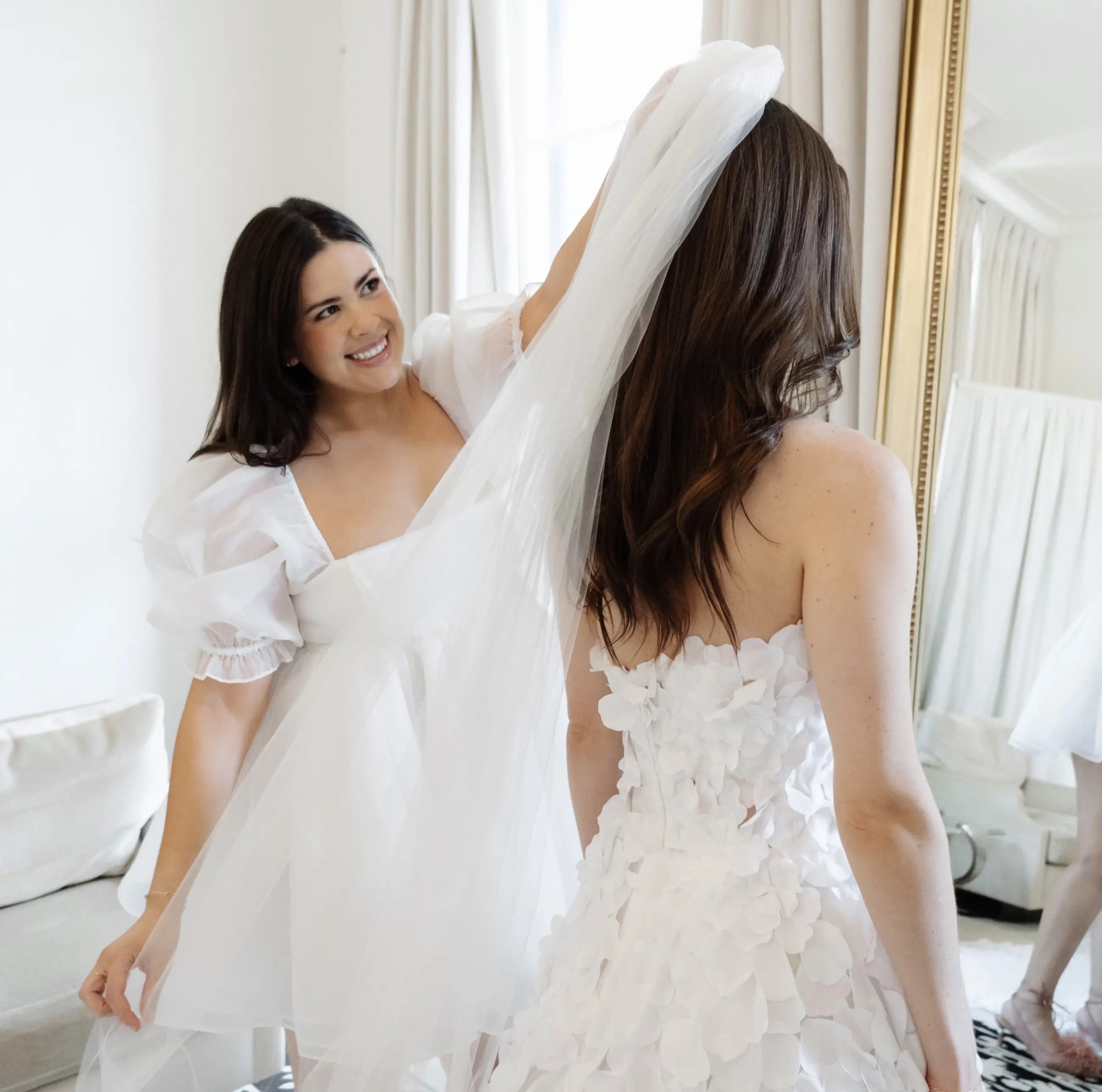 Model near a white dresses